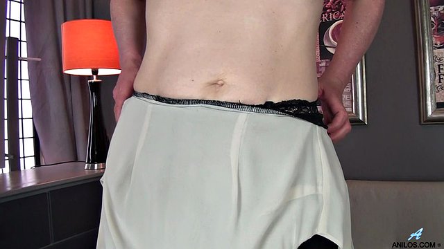 Redhead milf with saggy tits shows her goods