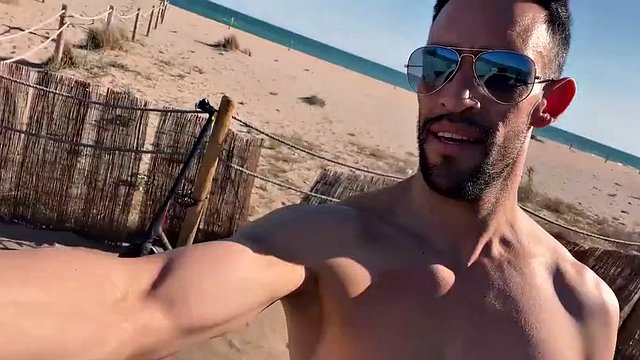 Naked sexy latin man on a public beach