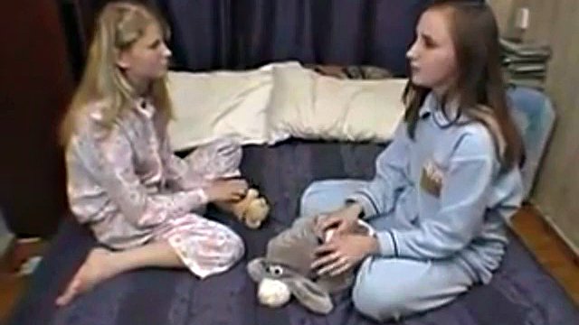 Cute lesbian girls karina and Alya on the bed