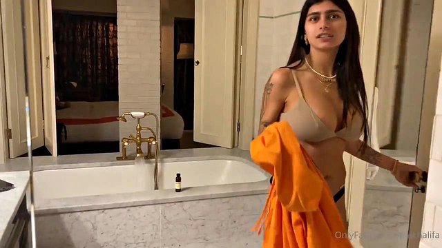 Mia Khalifa's Big Tits Soak in Steamy Shower