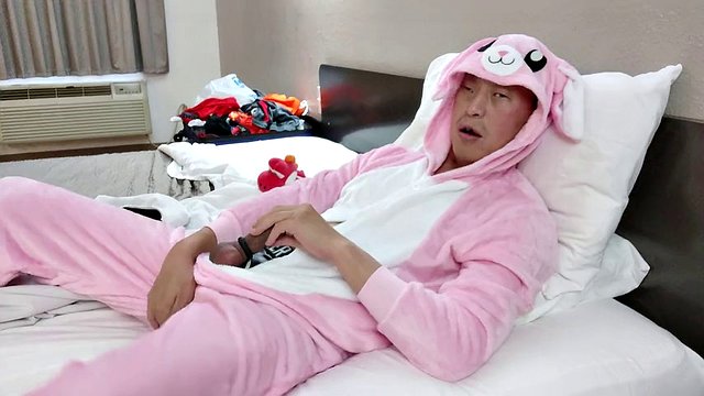Hot Asian posing in my new pink jumpsuit and black zip up boxer briefs in a cheap motel