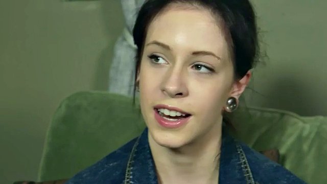 Perverted hipster does naked yoga and fingers her wet pussy