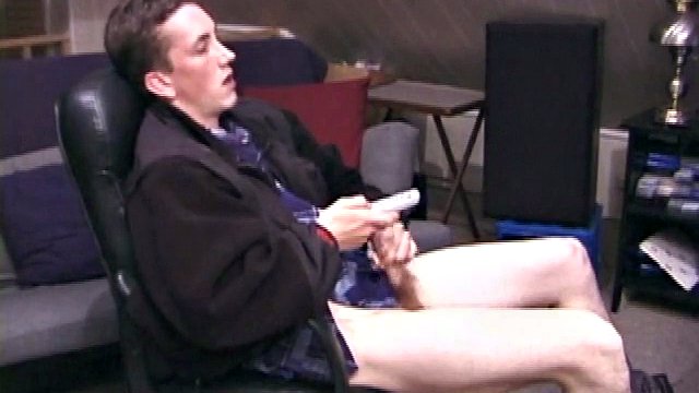 When Derek pulls his pants down, his hard cock sticks out and he starts stroking it. He obviously enjoys watching porn videos because Derek soon pumps his warm cum all over his stomach.