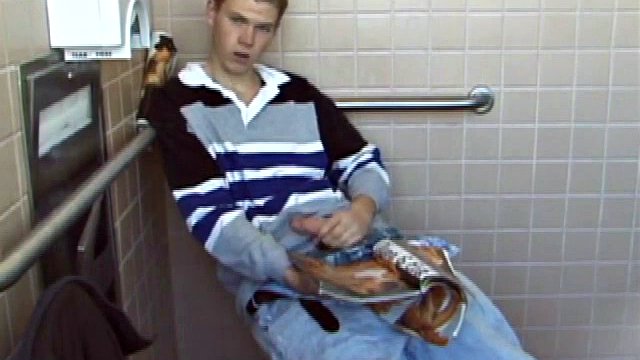 In the men's room, Christian unpacks a stack of porn magazines and flips through the pages in search of the right girl. Throwing off his pants and boxers, Christian jerks off hard, especially noisy due to the heavy lube.