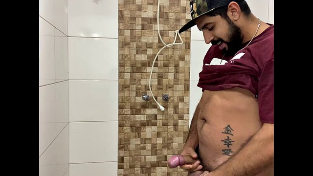Squirting cum, bearded man with a cap alone in the bathroom having fun in the handjob until he cums a lot - Rodrik Dick