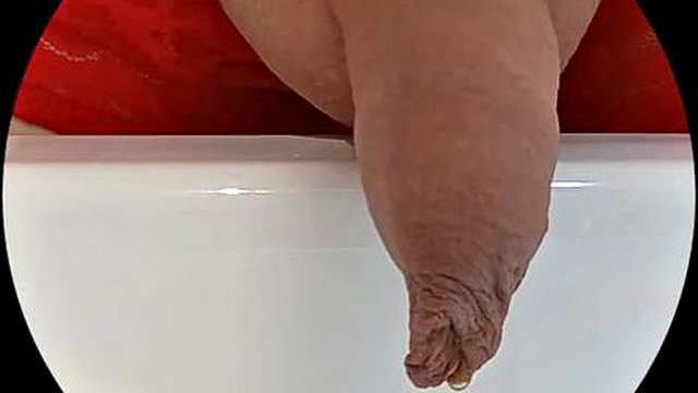 Sab-cd with long foreskin is spied on in the bathroom while pissing and cumming