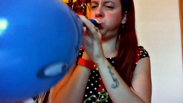 Your beautiful little sister plays with huge balloons