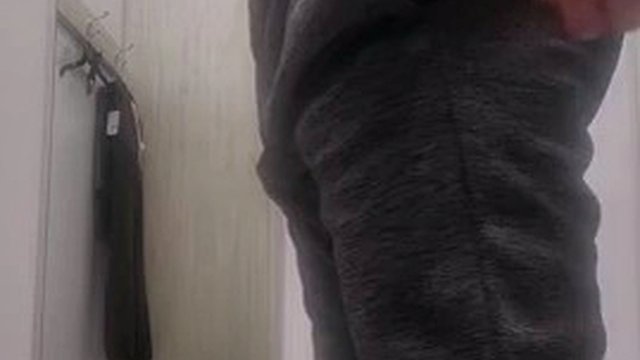 Trying on clothes in a sports store