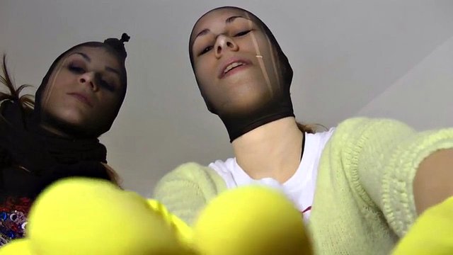 Robber girl trampling in nylon mask