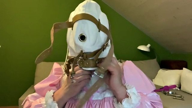 Sissy in diaper with bondage hood