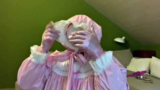 Sissy in diaper with bondage hood