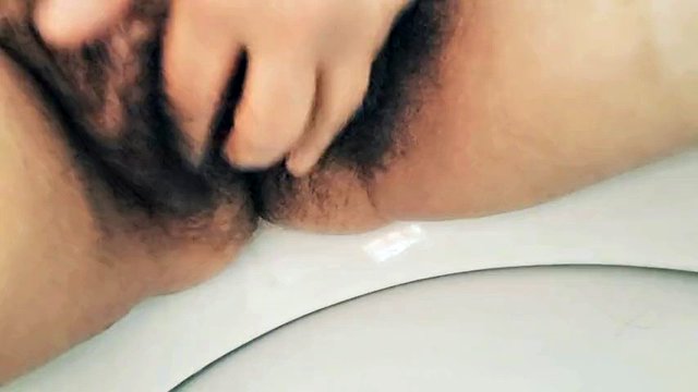 MILF stepmom peeing hairy pussy in bathroom